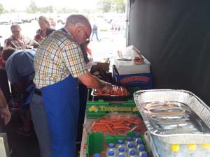 Cooking sausages and onions at Bunnings Mile End Warehouse