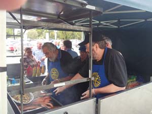 Cooking sausages and onions at Bunnings Mile End Warehouse